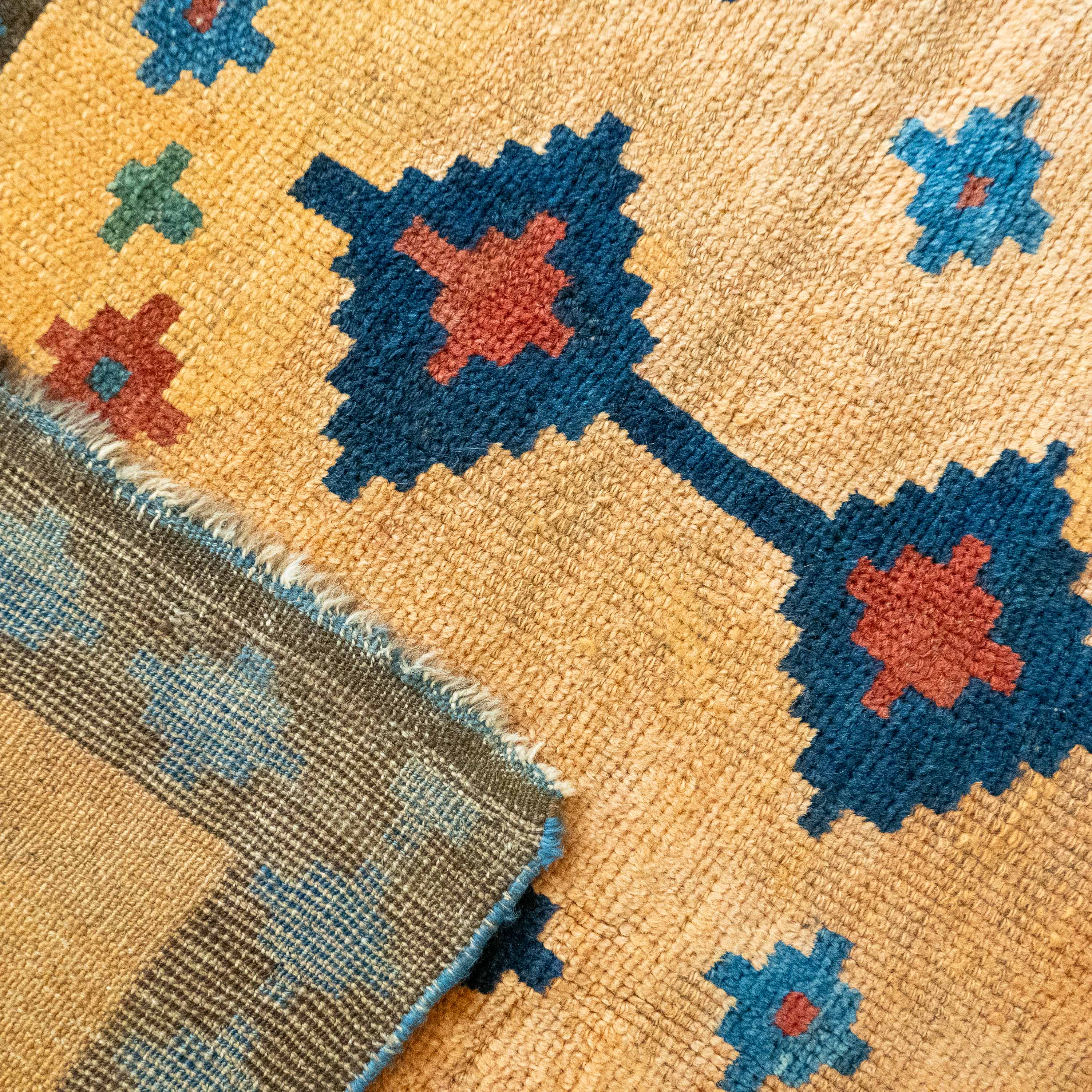 Antique Tribal Gabbeh, 7'0" x 4'9" Persian Rug with Gold and Indigo Star Motifs, Persia (c. 1925)