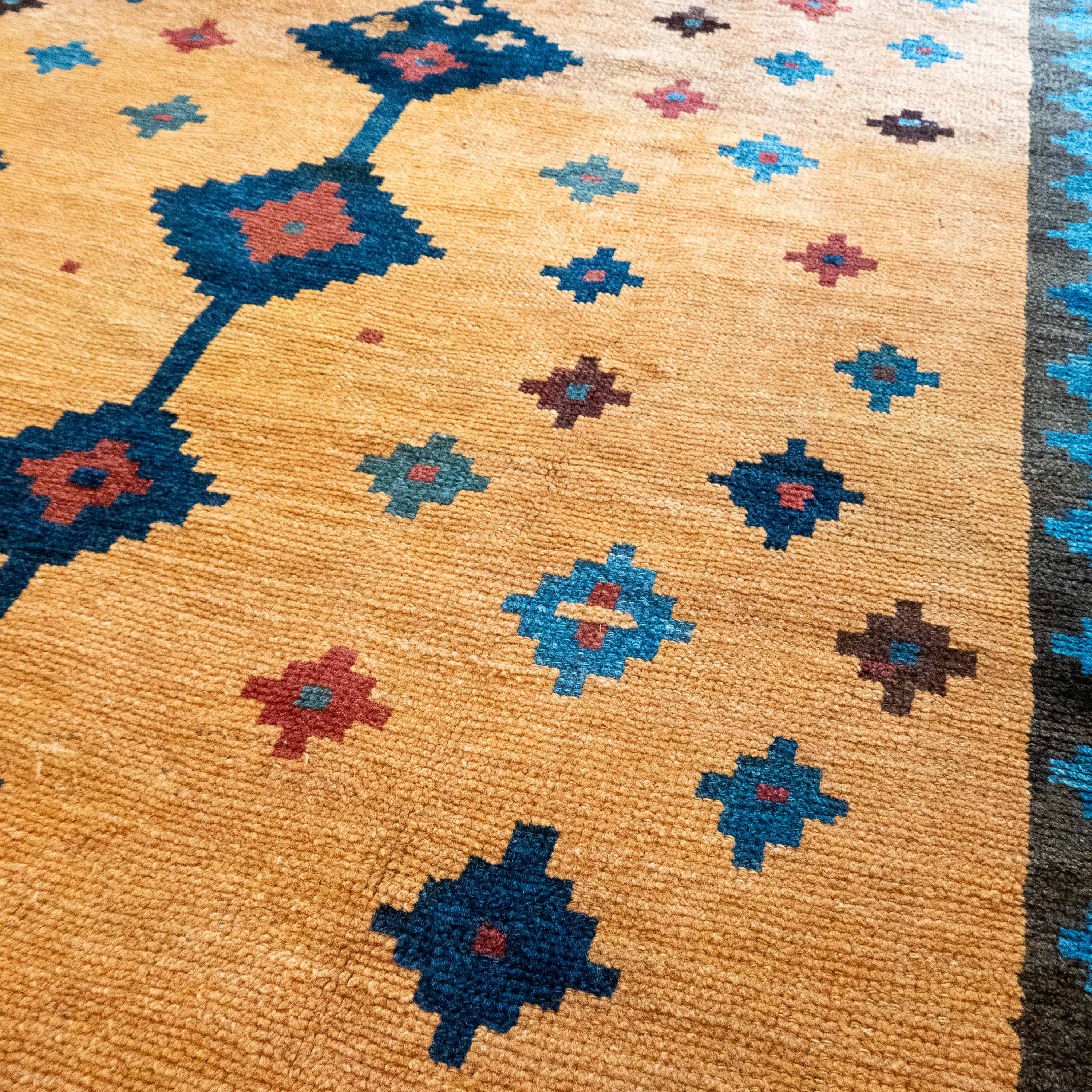 Antique Tribal Gabbeh, 7'0" x 4'9" Persian Rug with Gold and Indigo Star Motifs, Persia (c. 1925)