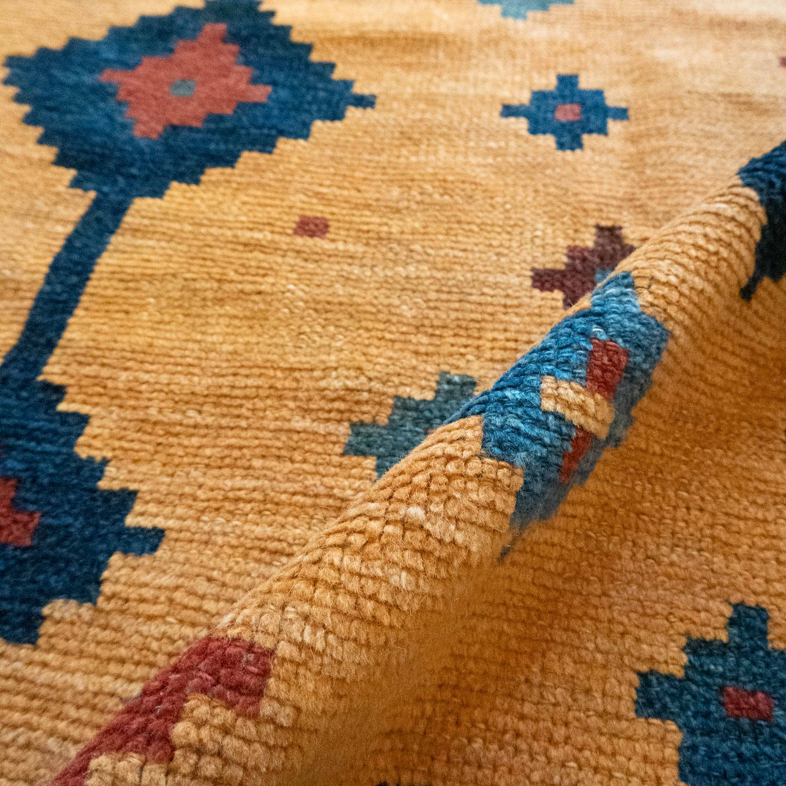 Antique Tribal Gabbeh, 7'0" x 4'9" Persian Rug with Gold and Indigo Star Motifs, Persia (c. 1925)